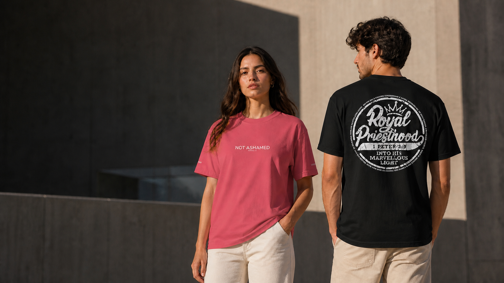 Two models wearing the Not Ashamed and Royal Priesthood Scripture Brand T-shirts