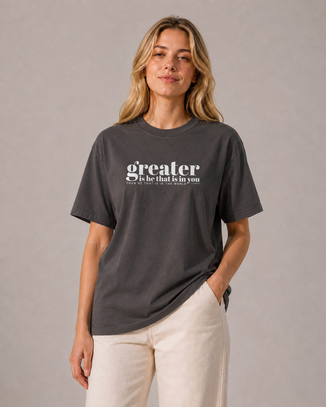 Model wearing the Greater Is He T‑Shirt